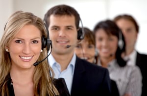 business customer support team in an office with headsets